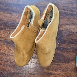 Brown closed toed wedge heel with spikes